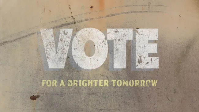 An old, worn sign urging people to vote
